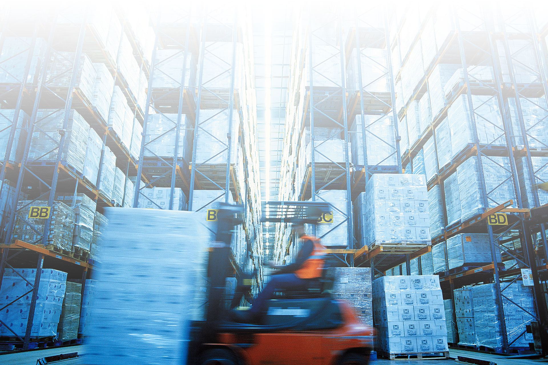 person operating a forklift in a warehouse